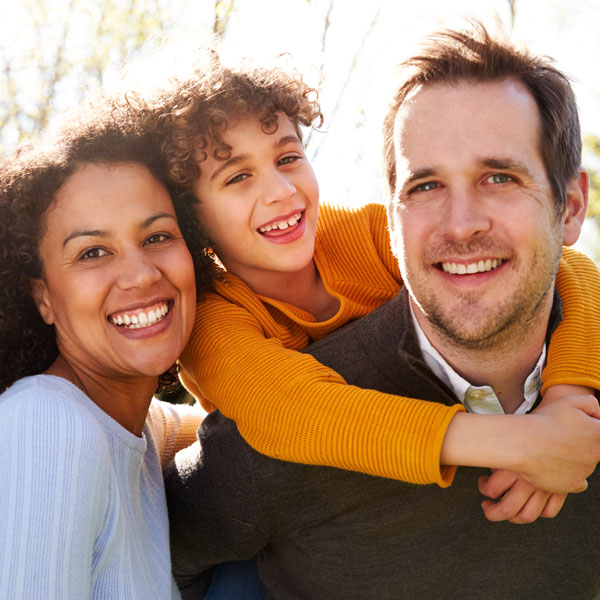 Happy family after undergoing a smile makeover in Wyoming, MI