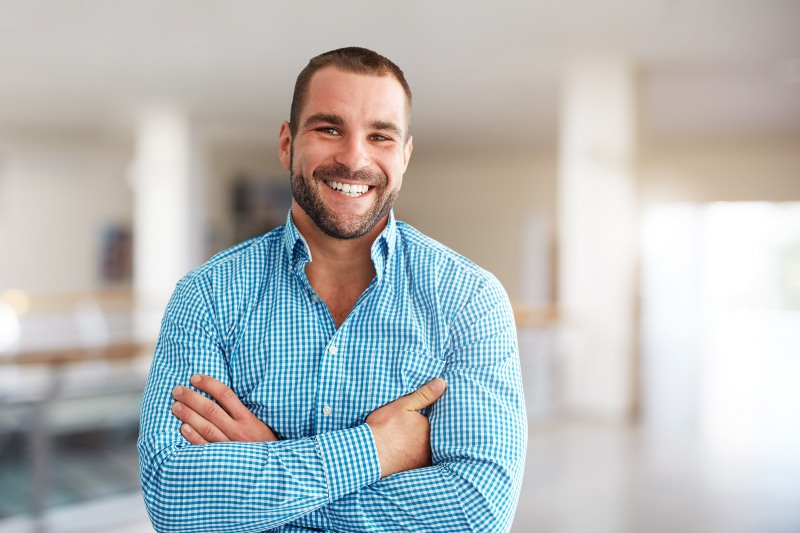 Man happy after undergoing dental bonding procedure in Wyoming, MI