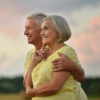 Couple smiling after undergoing enamel shaping process in Wyoming, MI